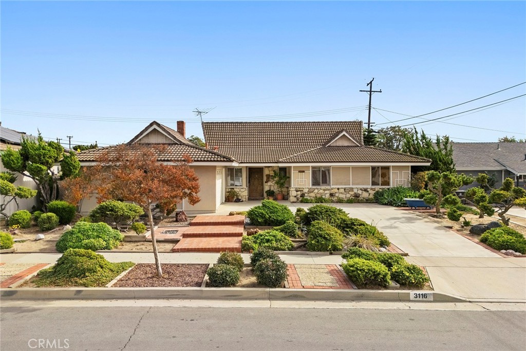 3116 Firethorne Avenue Fullerton, CA 92835 - Photo 28 of 32 a front view of a house with a yard