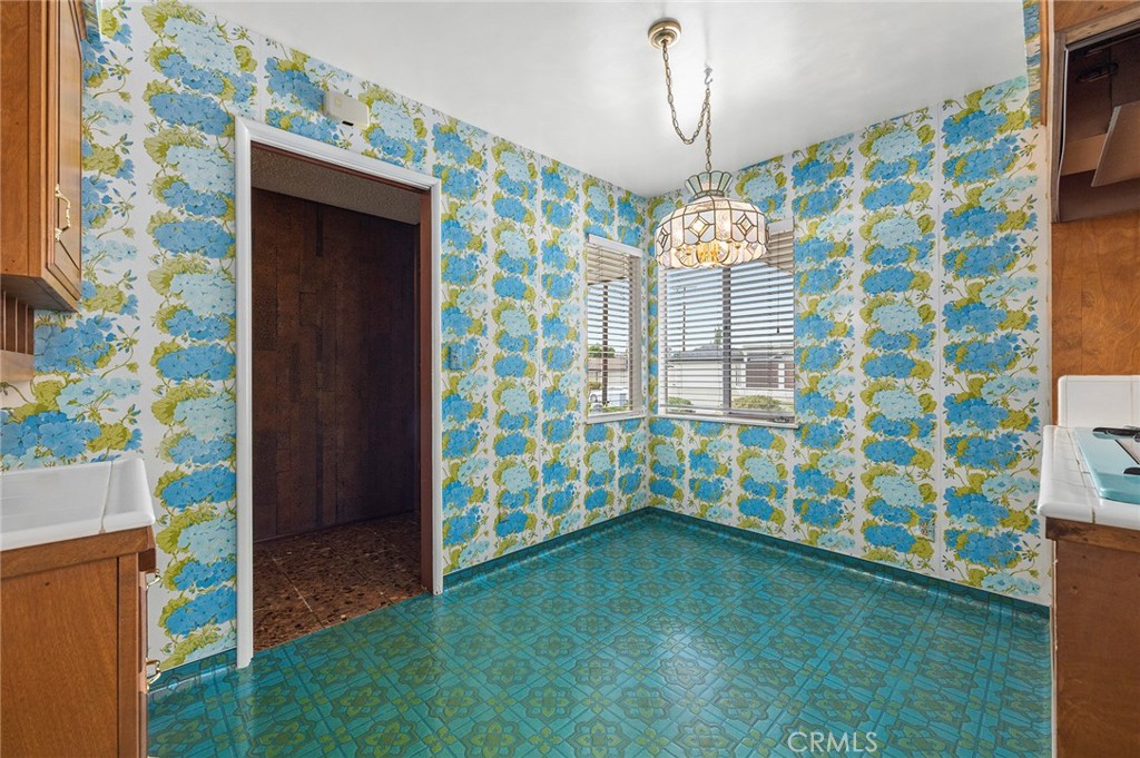 3116 Firethorne Avenue Fullerton, CA 92835 - Photo 7 of 32 a view of empty room with window and chandelier