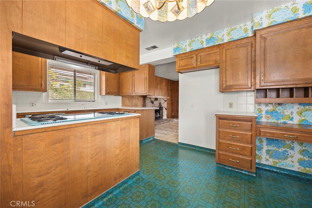 3116 Firethorne Avenue Fullerton, CA 92835 - Photo 9 of 32 a kitchen with stainless steel appliances granite countertop a refrigerator and a stove top oven