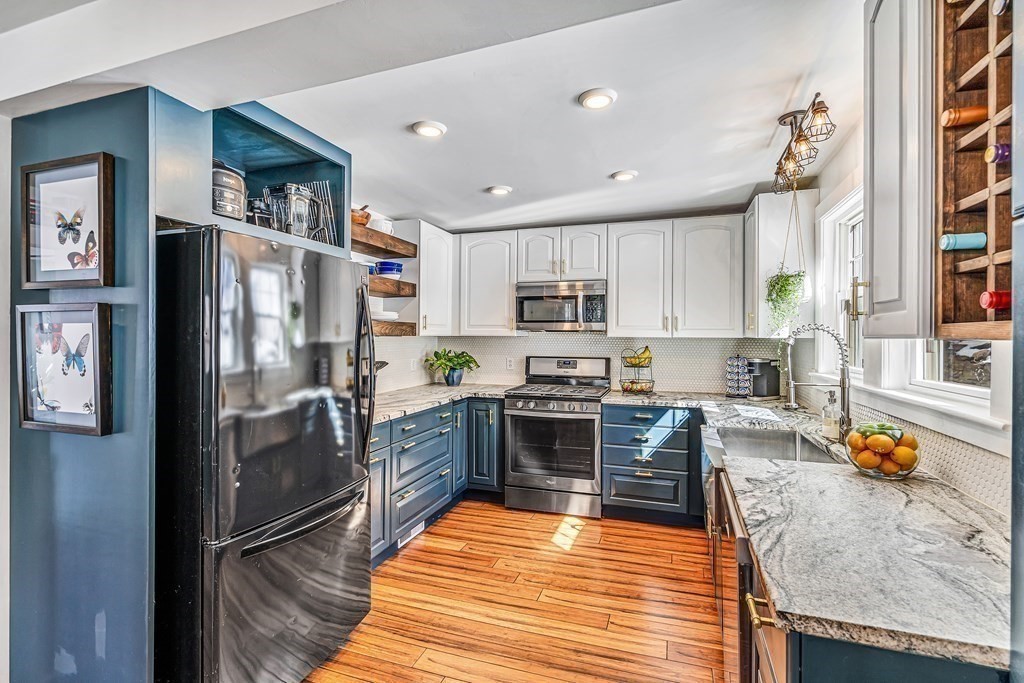 37 Acre Street Clinton, MA 01510 - Photo 16 of 38 a kitchen with stainless steel appliances granite countertop a refrigerator stove microwave and sink
