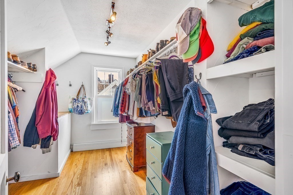 37 Acre Street Clinton, MA 01510 - Photo 29 of 38 a view of walk in closet with clothes and shoes