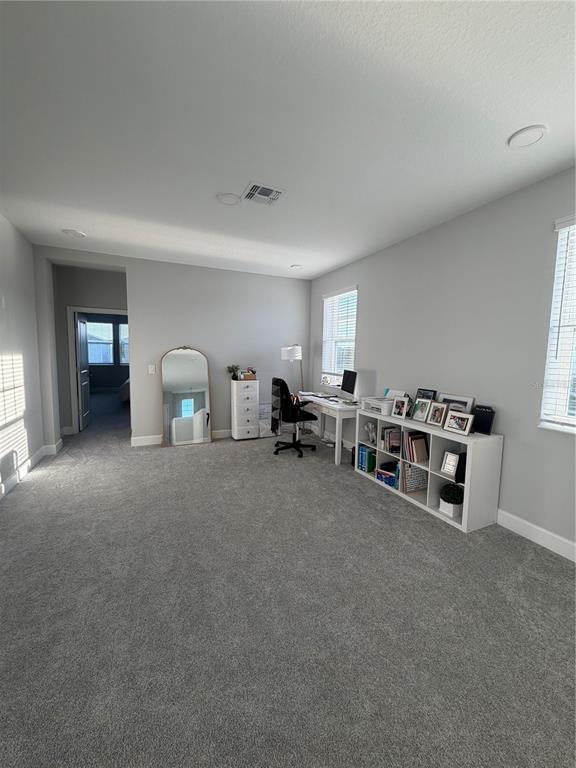 1389 Lumpini Street St. Cloud, FL 34771 - Photo 23 of 32 a room with furniture and a large window