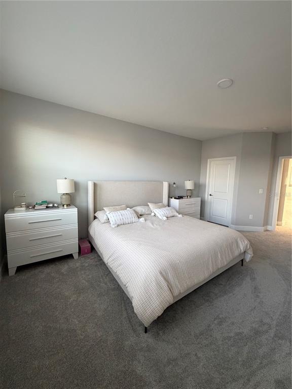 1389 Lumpini Street St. Cloud, FL 34771 - Photo 25 of 32 a bedroom with bed and window