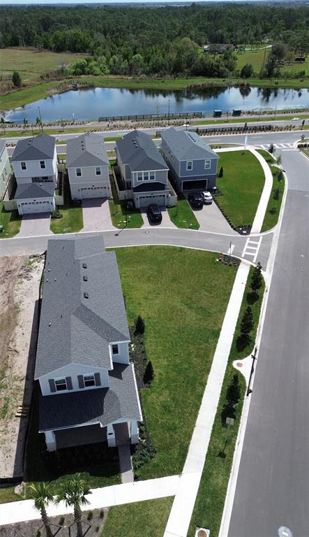 1389 Lumpini Street St. Cloud, FL 34771 - Photo 31 of 32 an aerial view of a house with outdoor space and lake view