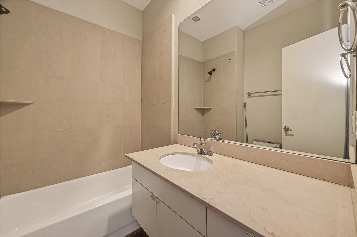 1112 Columbus Street, Unit B Houston, TX 77019 - Photo 15 of 31 a bathroom with a sink and a bathtub