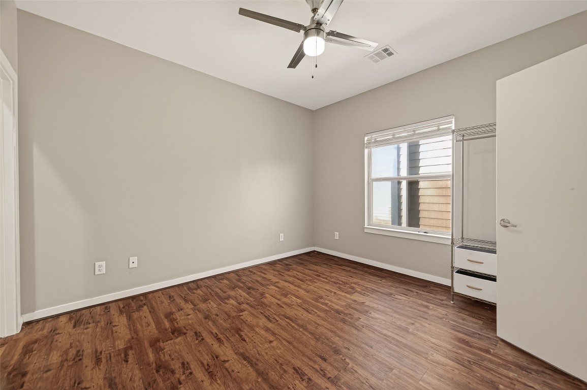 1112 Columbus Street, Unit B Houston, TX 77019 - Photo 17 of 31 wooden floor in an empty room with a window