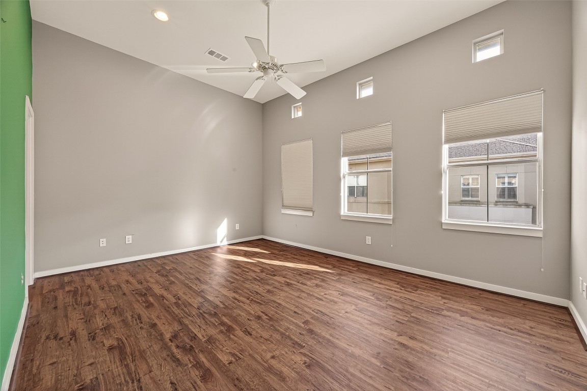 1112 Columbus Street, Unit B Houston, TX 77019 - Photo 21 of 31 a view of an empty room with wooden floor and a window