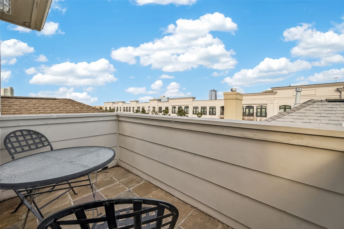 1112 Columbus Street, Unit B Houston, TX 77019 - Photo 28 of 31 a view of a balcony dining table and chairs