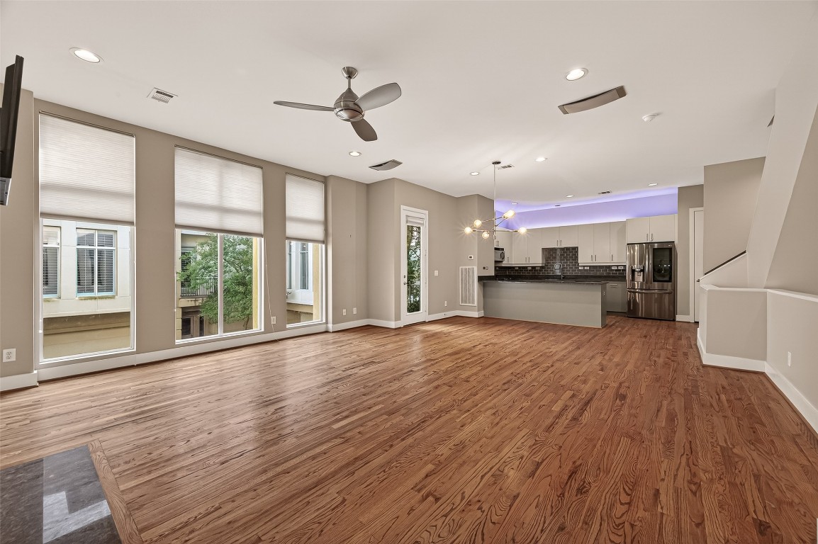 1112 Columbus Street, Unit B Houston, TX 77019 - Photo 4 of 31 a view of empty room with wooden floor and window