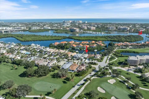 an aerial view of a house with a lake view