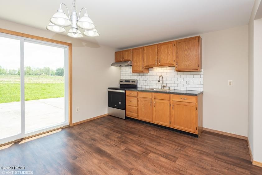 110 Boulder Road Lake Ariel, PA 18436 - Photo 5 of 18 a kitchen with stainless steel appliances granite countertop a sink cabinets and wooden floor