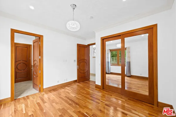 a view of an empty room with a balcony