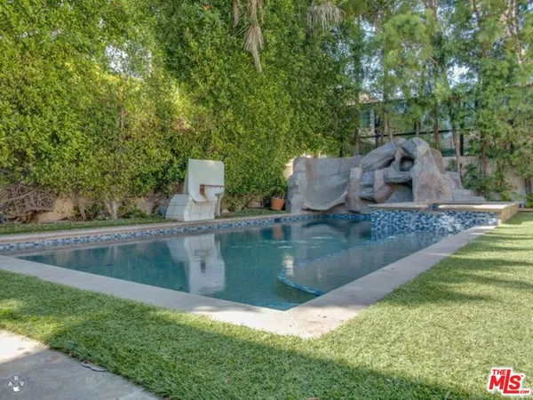 an aerial view of a house with outdoor space