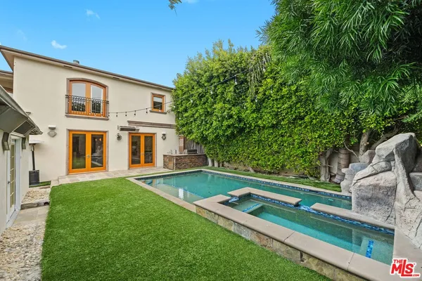a bedroom with a bed and cabinets