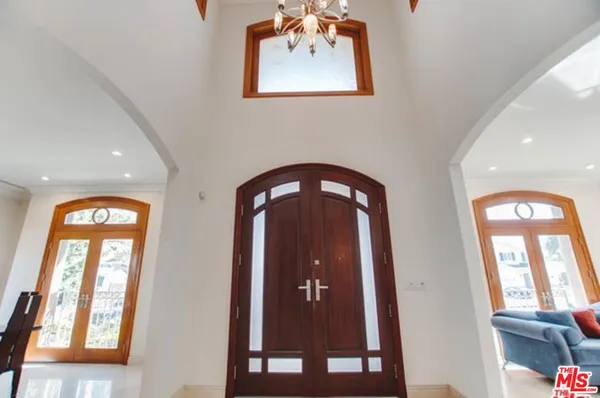 a front view of a house with large windows