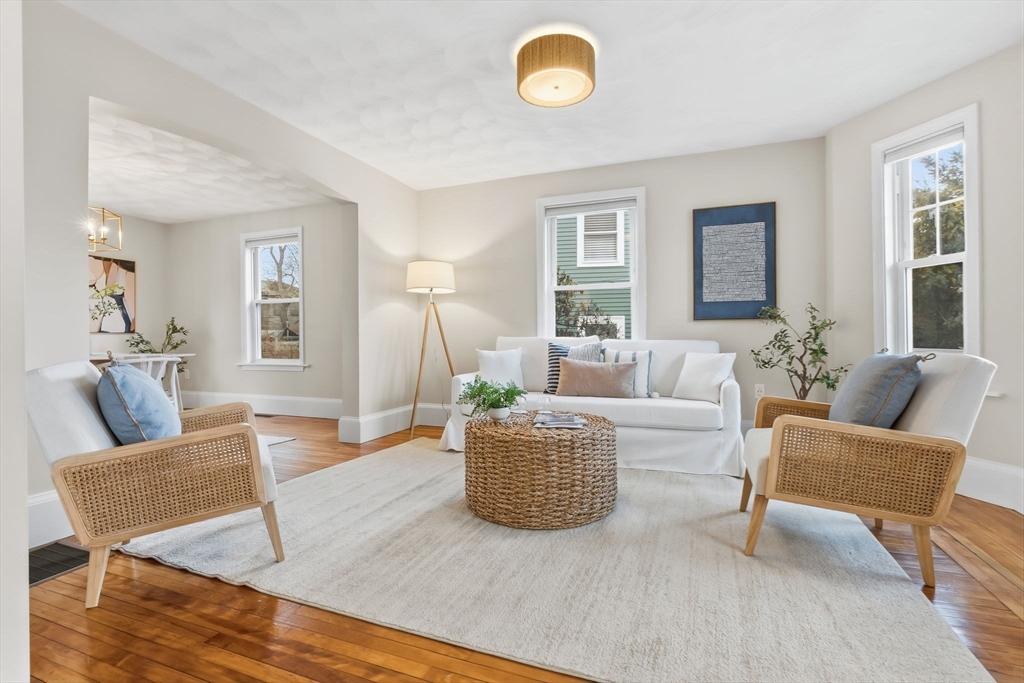 5 Pickett Street Beverly, MA 01915 - Photo 1 of 30 a living room with furniture and a table