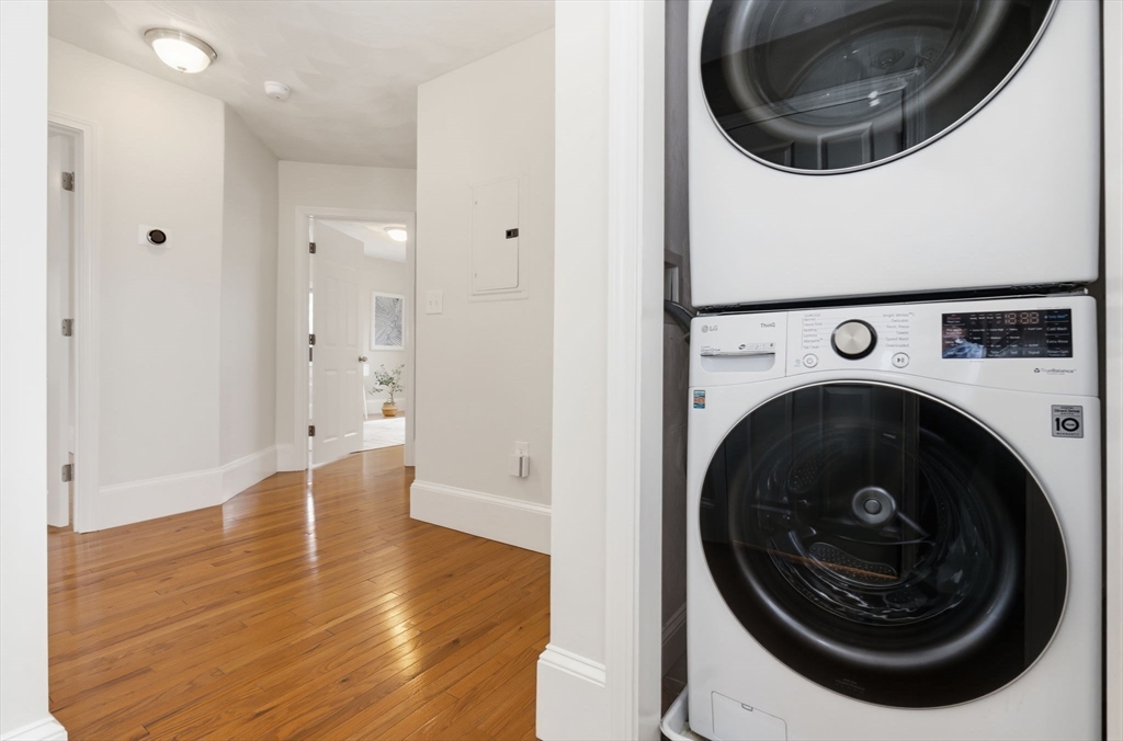 5 Pickett Street Beverly, MA 01915 - Photo 11 of 30 a view of a hallway with washer and dryer