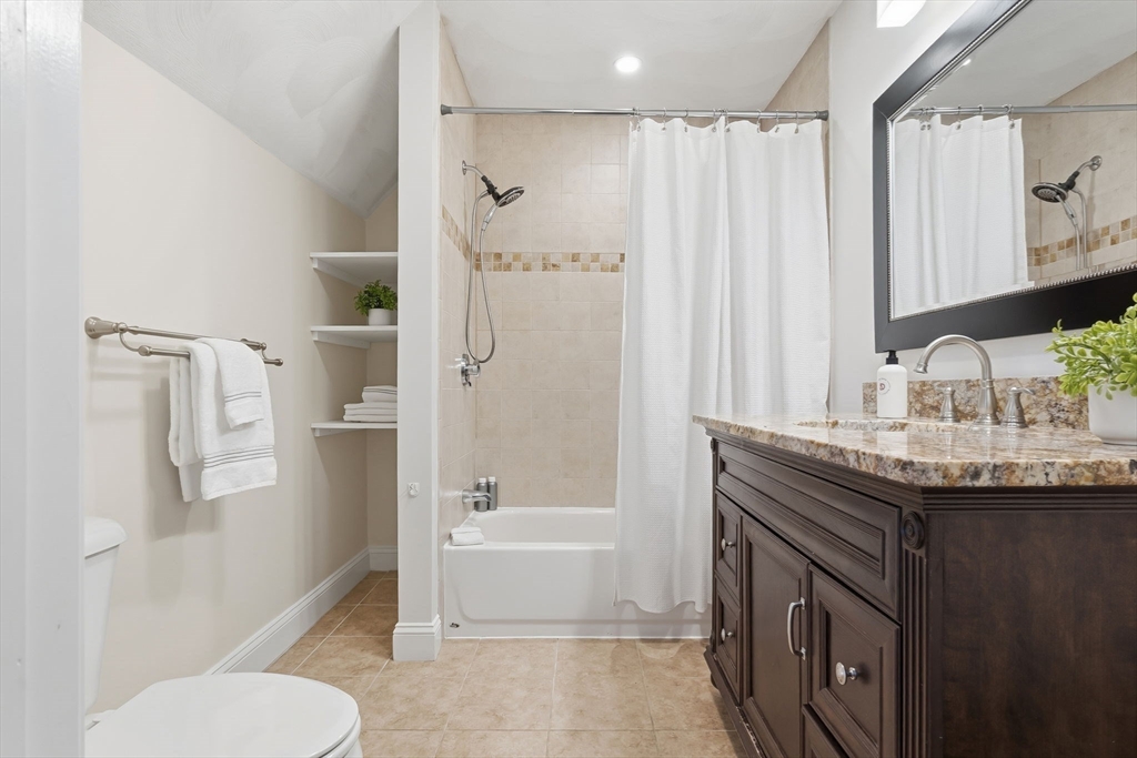 5 Pickett Street Beverly, MA 01915 - Photo 16 of 30 a bathroom with a granite countertop sink toilet and shower