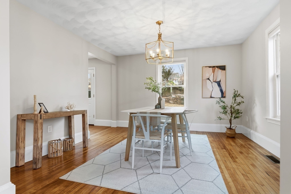 5 Pickett Street Beverly, MA 01915 - Photo 4 of 30 a view of a dining room with furniture and wooden floor