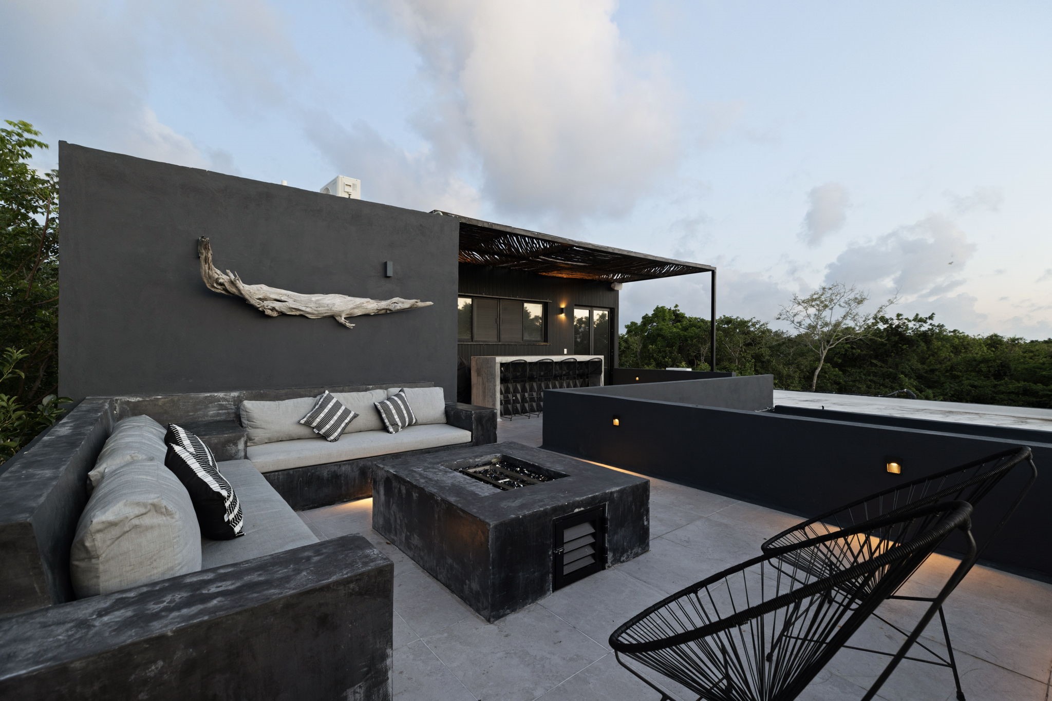 6 Country Club, Unit 4 Nome, TX 77629 - Photo 7 of 45 This sprawling, multi-tiered rooftop sanctuary delivers an unmatched indoor-outdoor entertainment experience against a backdrop of endless emerald jungle.