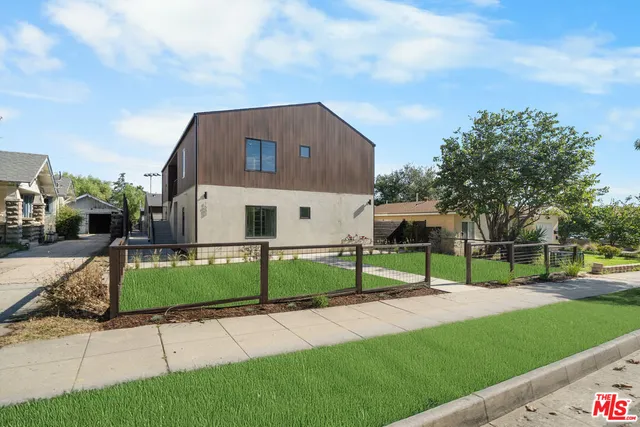 a house view with a garden space