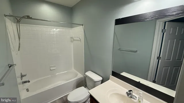 a bathroom with a bathtub toilet and sink