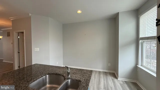 a view of a livingroom with furniture and wooden floor
