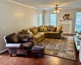 106 Antique Court Pendleton, SC 29670 - Photo 2 of 18 Relax in this comfortable living room, featuring rich hardwood floors and abundant natural light.