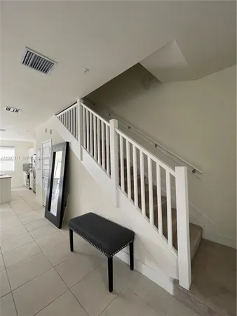 a view of a hallway with seating area