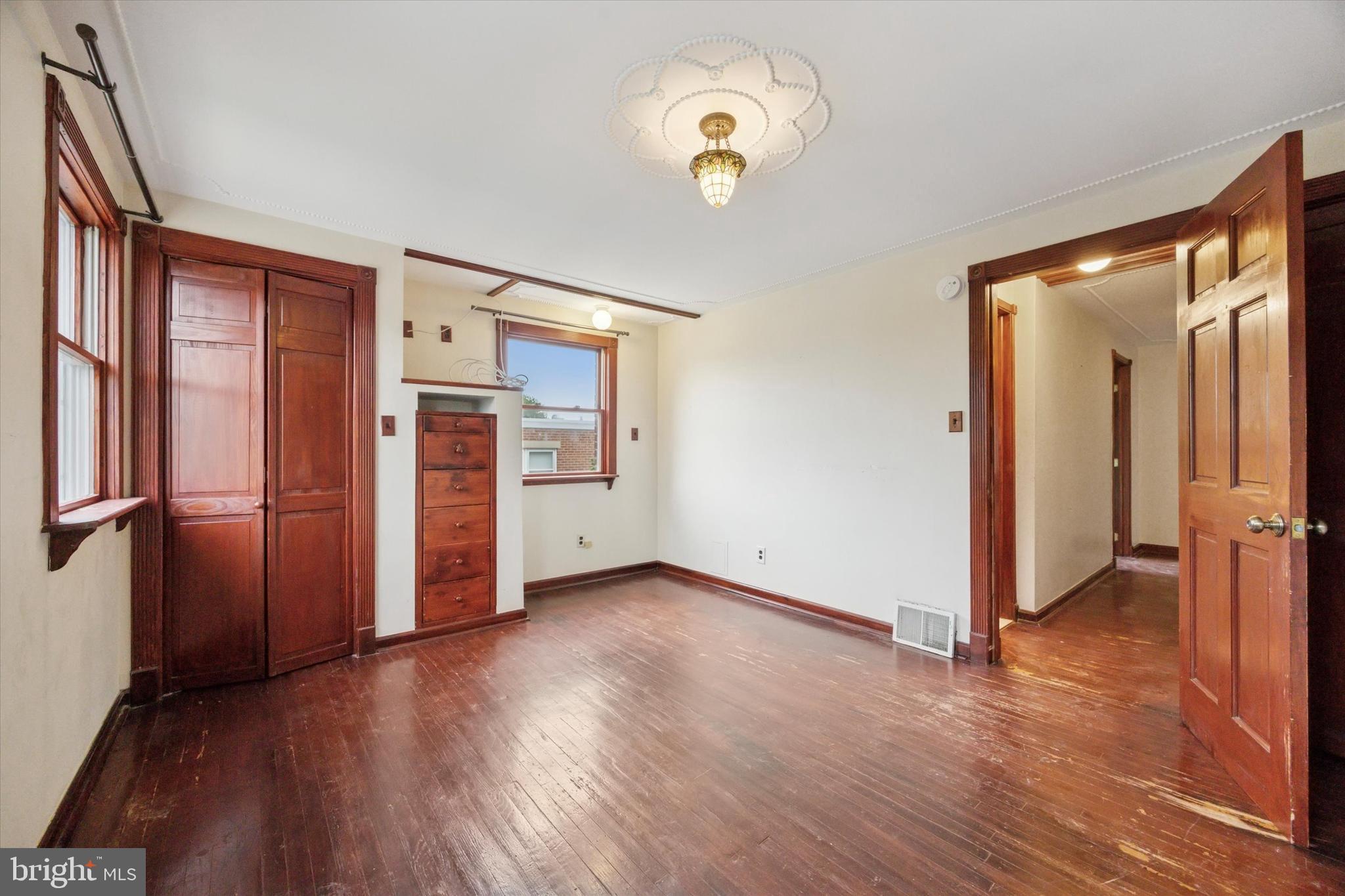 547 Overlook Road Philadelphia, PA 19128 - Photo 17 of 24 an empty room with wooden floor closet and windows