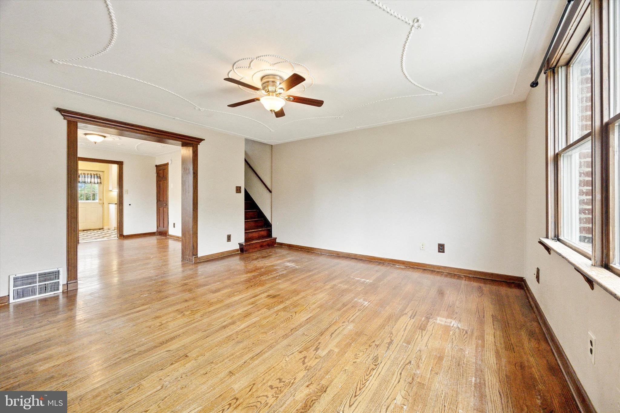 547 Overlook Road Philadelphia, PA 19128 - Photo 5 of 24 a view of an empty room with wooden floor and a window