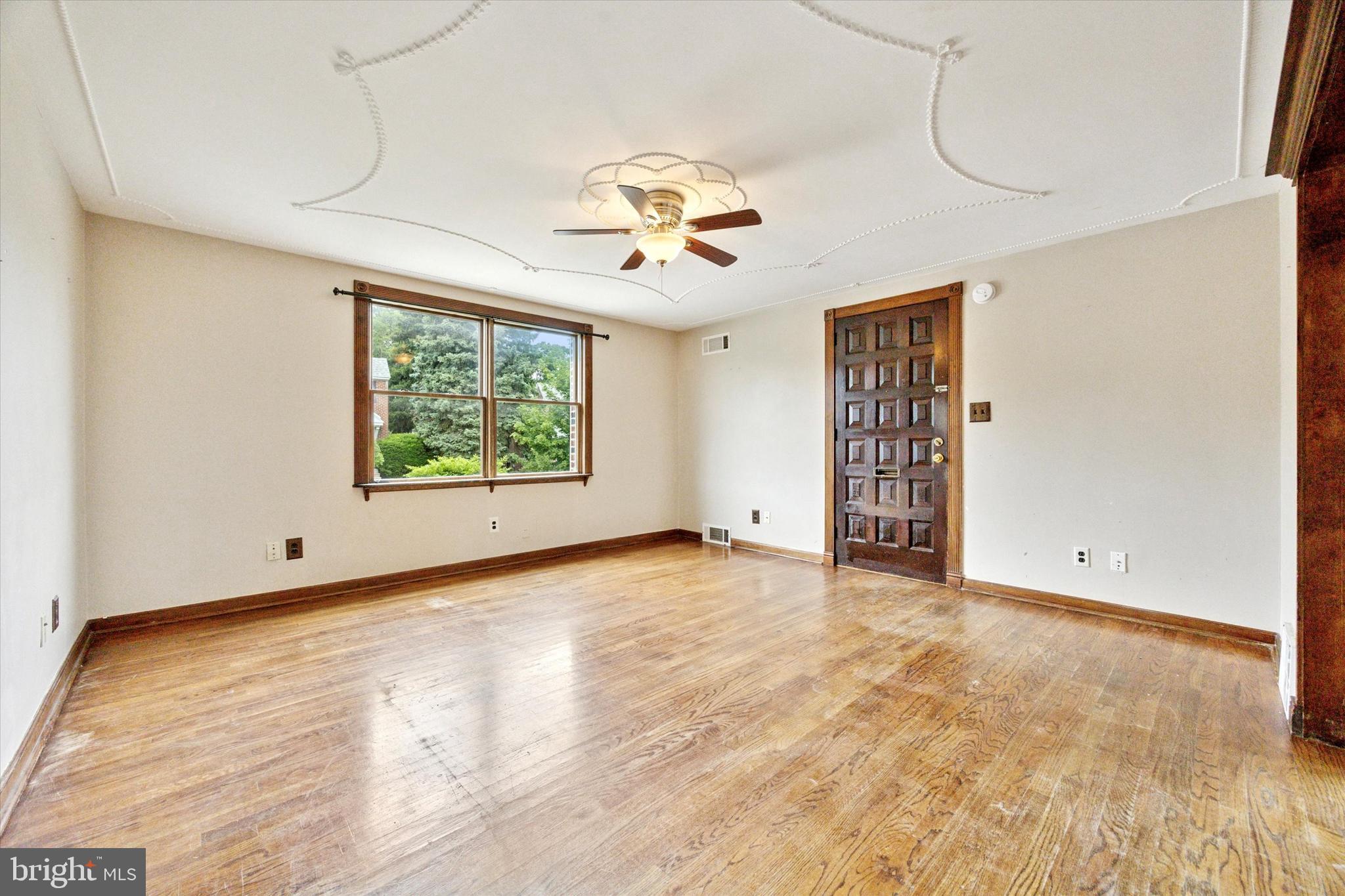 547 Overlook Road Philadelphia, PA 19128 - Photo 6 of 24 wooden floor in an empty room with a window