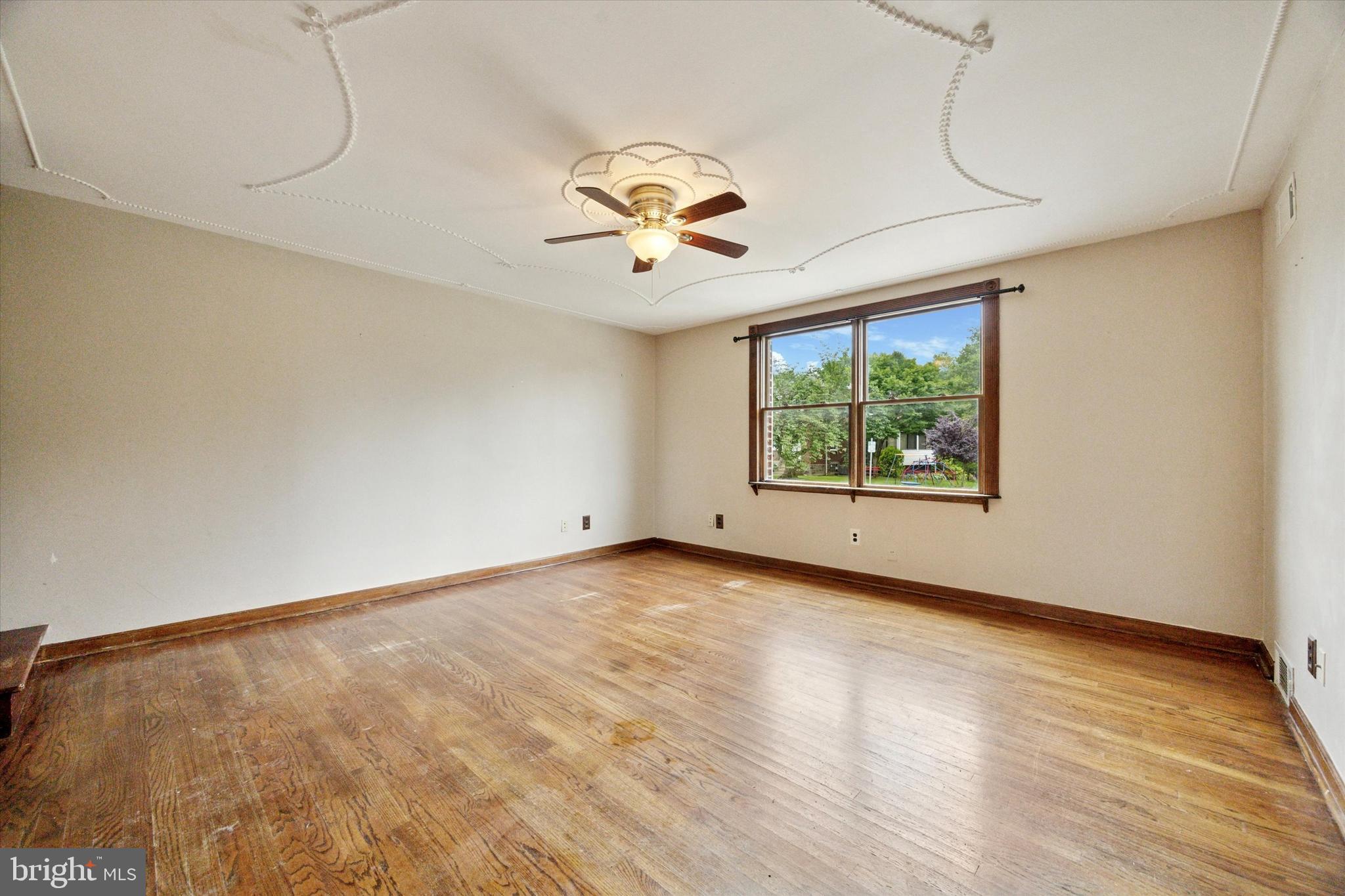 547 Overlook Road Philadelphia, PA 19128 - Photo 7 of 24 wooden floor in an empty room with a window