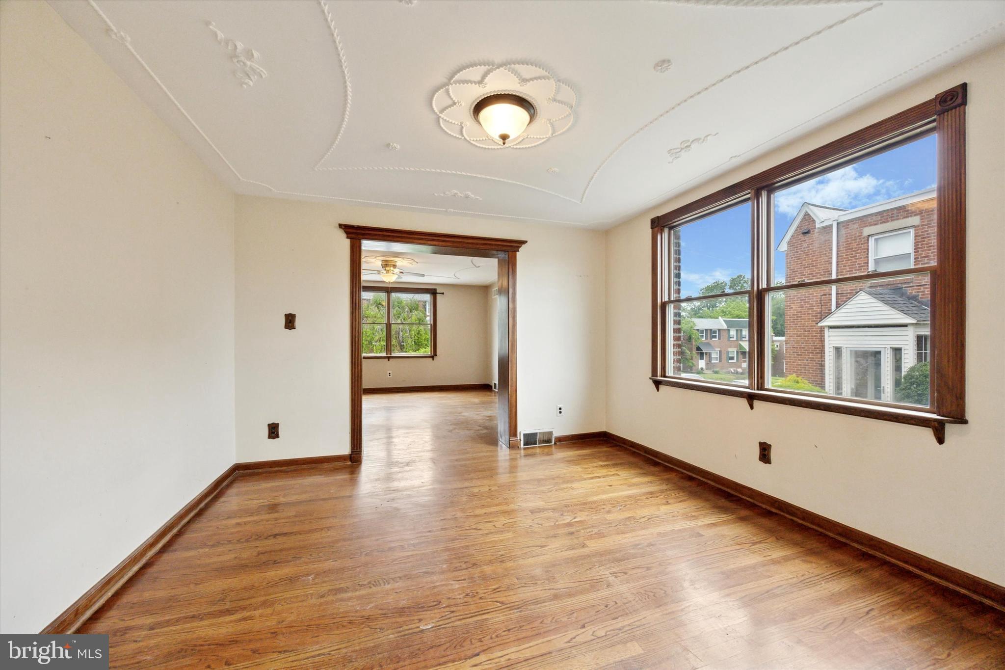 547 Overlook Road Philadelphia, PA 19128 - Photo 9 of 24 a view of an empty room with wooden floor and windows