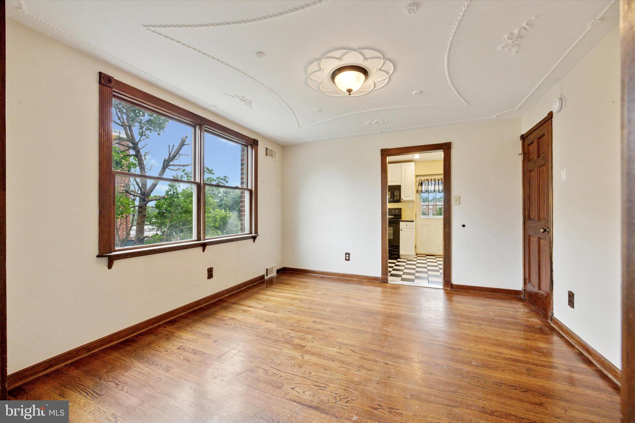 547 Overlook Road Philadelphia, PA 19128 - Photo 10 of 24 an empty room with wooden floor and windows
