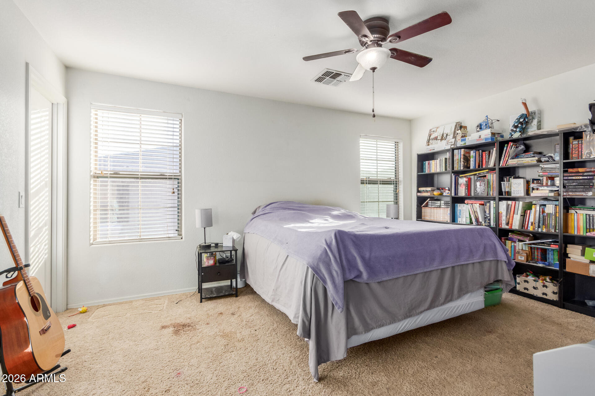 1265 South Aaron, Unit 346 Mesa, AZ 85209 - Photo 13 of 34 a bedroom with a bed furniture and a book shelf
