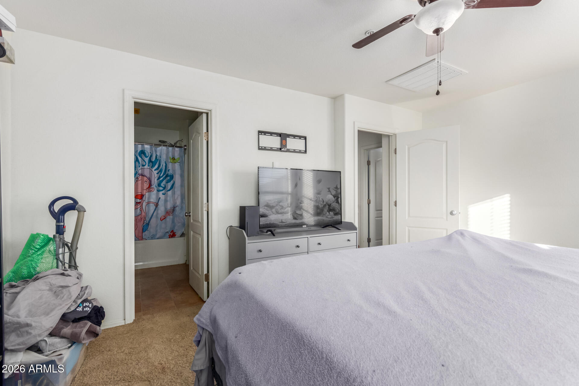 1265 South Aaron, Unit 346 Mesa, AZ 85209 - Photo 14 of 34 a bedroom with a bed and a chandelier