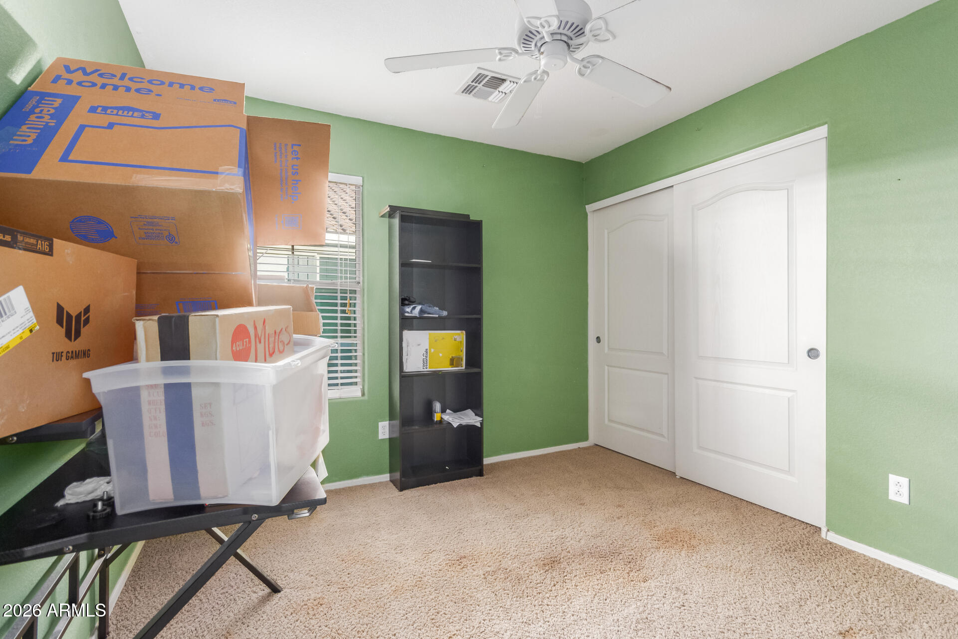 1265 South Aaron, Unit 346 Mesa, AZ 85209 - Photo 17 of 34 a living room with a couch and a chandelier