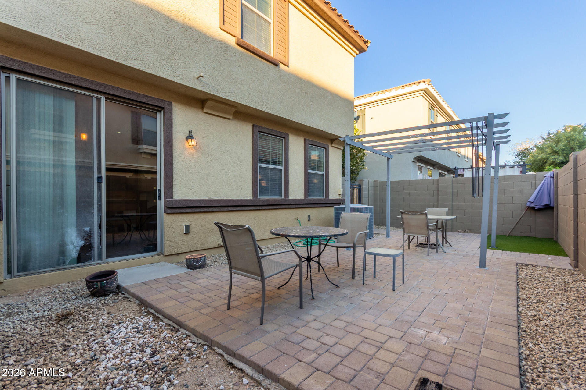 1265 South Aaron, Unit 346 Mesa, AZ 85209 - Photo 23 of 34 a view of a patio with table and chairs