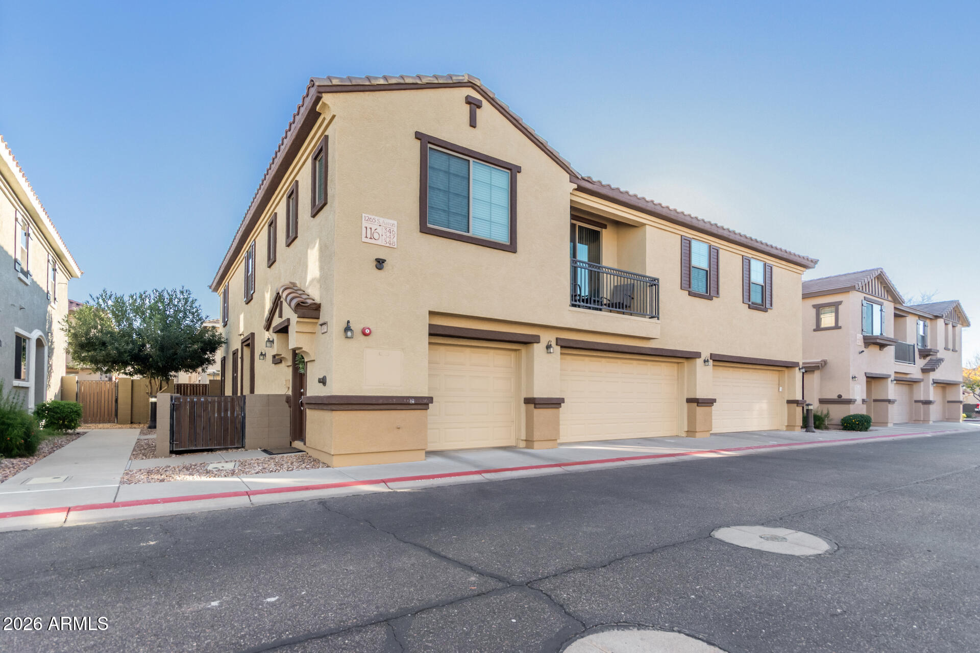 1265 South Aaron, Unit 346 Mesa, AZ 85209 - Photo 25 of 34 a front view of a house with a road