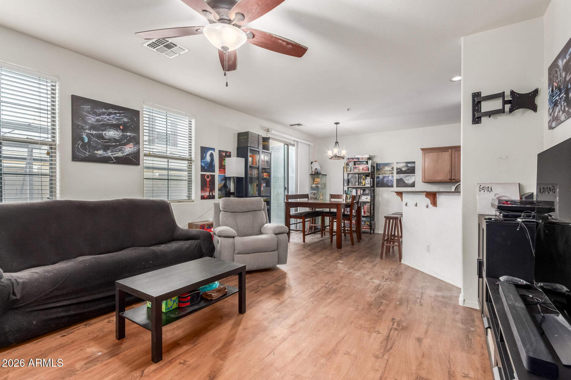 1265 South Aaron, Unit 346 Mesa, AZ 85209 - Photo 5 of 34 a living room with furniture and kitchen view