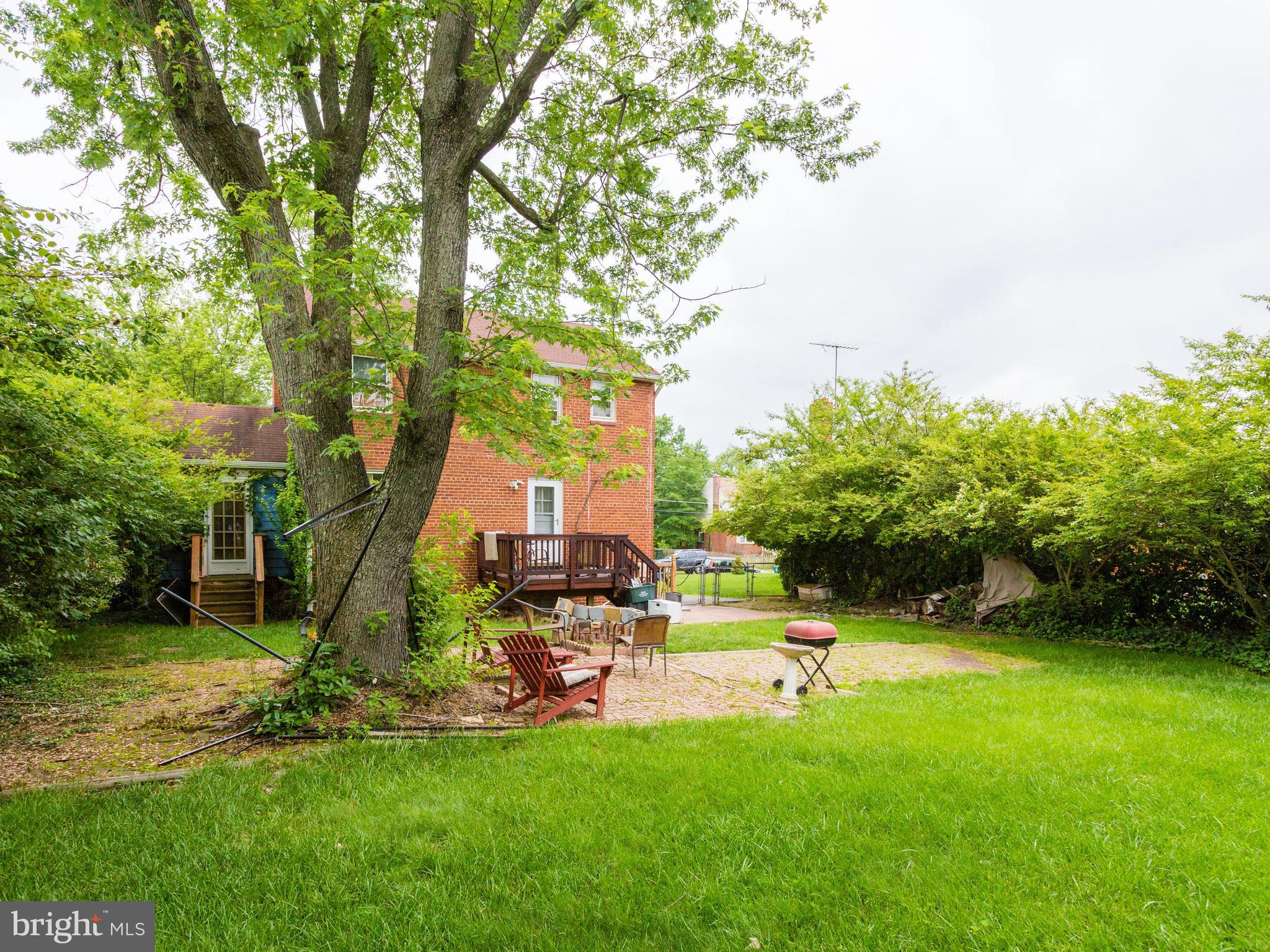 6014 Frederick Street Springfield, VA 22150 - Photo 22 of 28 a view of a park with swings and a large tree