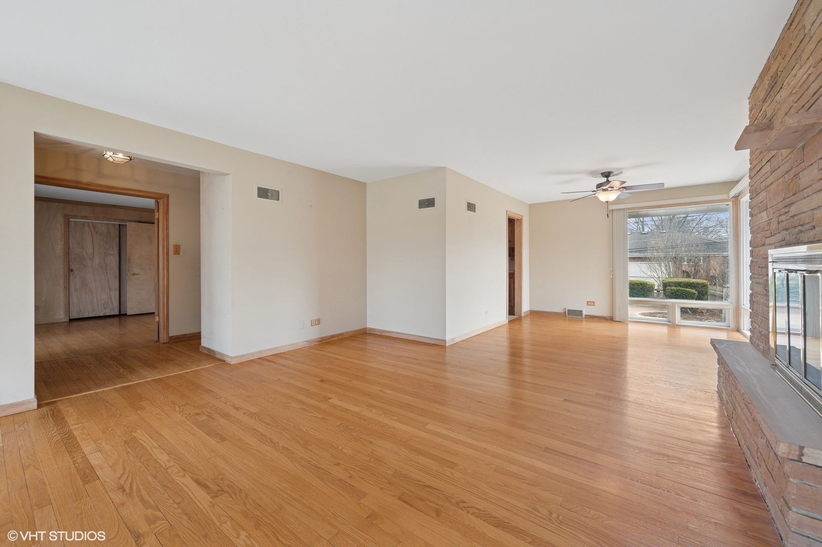 213 North Forest Avenue Mount Prospect, IL 60056 - Photo 2 of 18 a view of empty room with wooden floor and floor to ceiling window