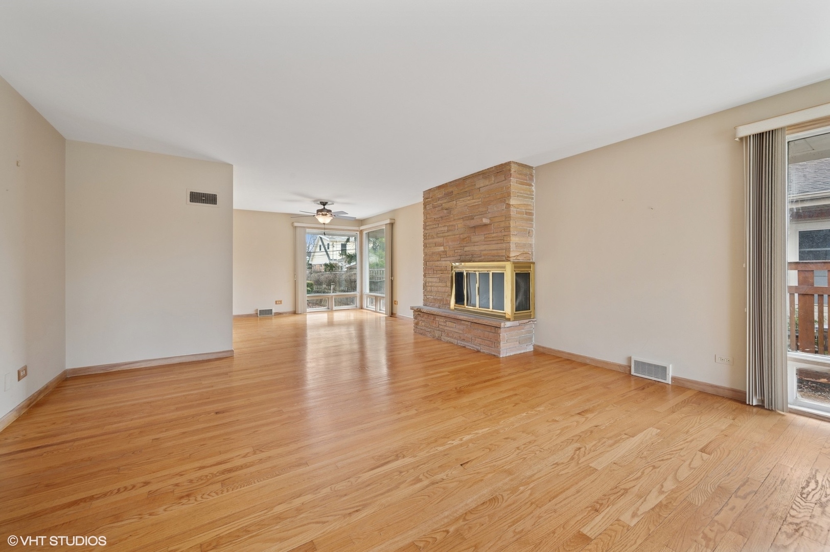 213 North Forest Avenue Mount Prospect, IL 60056 - Photo 4 of 18 a view of empty room with wooden floor and fireplace