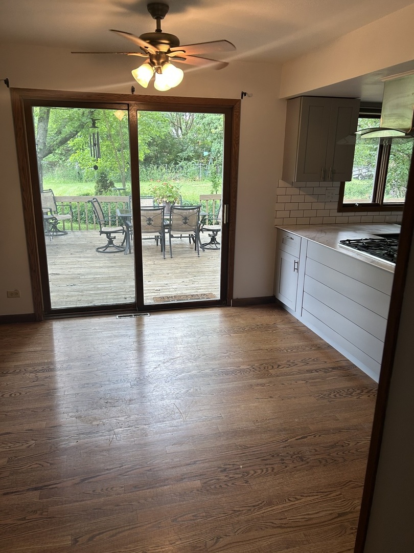 1125 Morningside Drive Elgin, IL 60123 - Photo 11 of 42 a view of a kitchen with a dishwasher cabinets and a large window