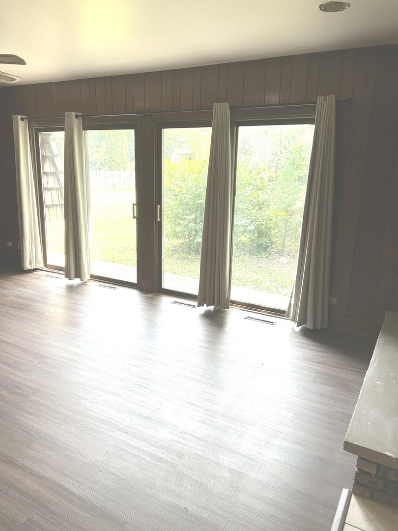 1125 Morningside Drive Elgin, IL 60123 - Photo 20 of 42 a view of an empty room with wooden floor and a window