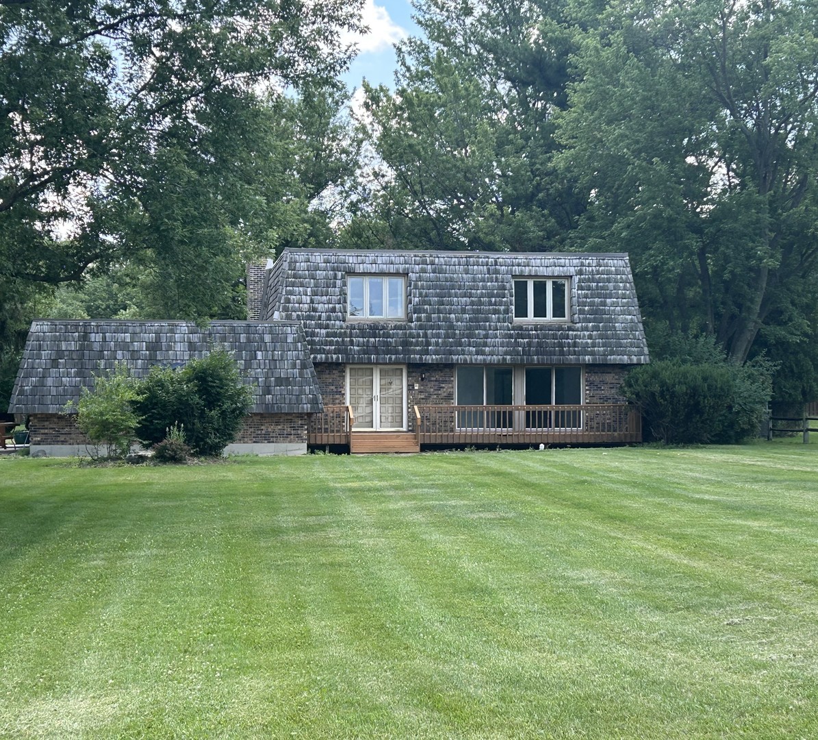 1125 Morningside Drive Elgin, IL 60123 - Photo 2 of 42 a front view of a house with a garden