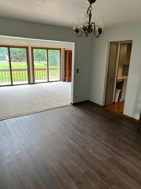 1125 Morningside Drive Elgin, IL 60123 - Photo 25 of 42 a view of an empty room with wooden floor and a window