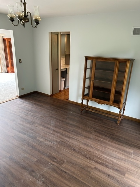 1125 Morningside Drive Elgin, IL 60123 - Photo 26 of 42 a view of an empty room with wooden floor and a window
