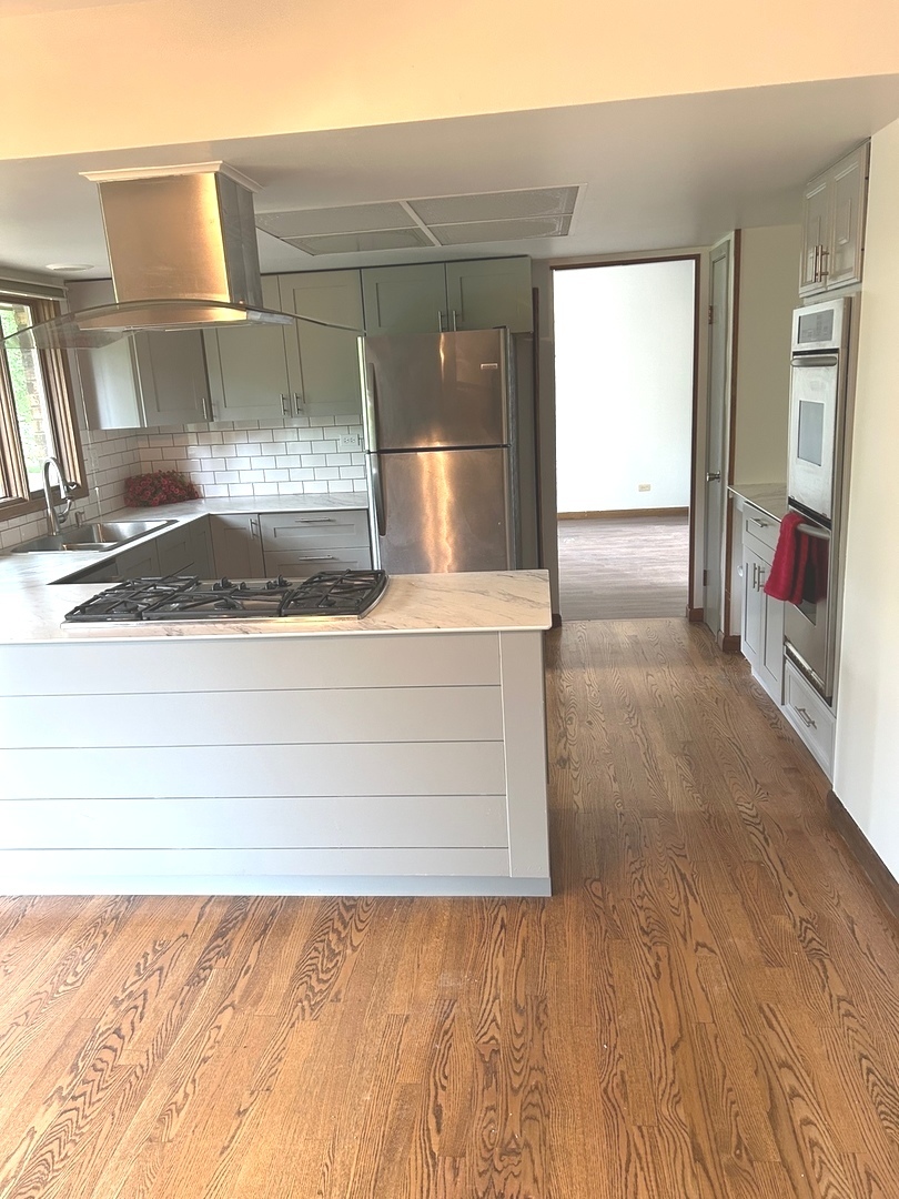 1125 Morningside Drive Elgin, IL 60123 - Photo 4 of 42 a view of kitchen and utility room